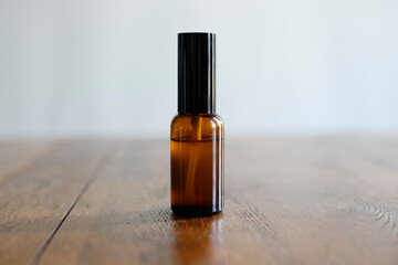 brown perfume bottle aroma therapy on wooden natural table