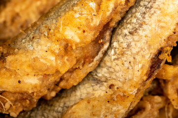 Small fried fish, surface texture, background image, close-up, selective focus.