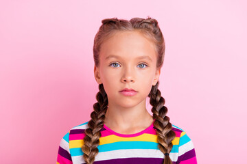 Photo of calm serious focused little lady braids hairstyle wear striped shirt isolated pink color background - Powered by Adobe