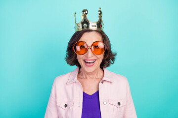 Photo portrait woman wearing golden crown sunglass smiling overjoyed isolated bright turquoise...