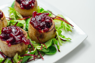 Mini pork pies, seasoned British pork, wrapped in crisp, flavoursome pastry served with  beetroot and orange chutney on topl