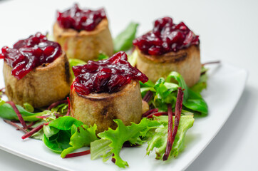 Mini pork pies, seasoned British pork, wrapped in crisp, flavoursome pastry served with  beetroot and orange chutney on topl