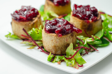 Mini pork pies, seasoned British pork, wrapped in crisp, flavoursome pastry served with  beetroot and orange chutney on topl