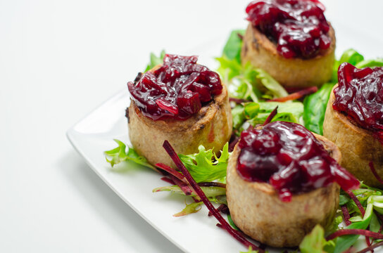 Mini pork pies, seasoned British pork, wrapped in crisp, flavoursome pastry served with  beetroot and orange chutney on topl