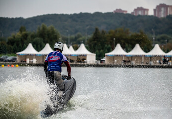 competition and freestyle in the program of competitions on aquabikes in open water on the lake 