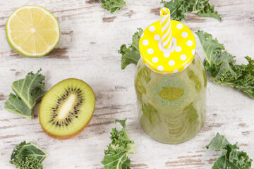 Freshly blended green coctail from fruits and vegetables. Diet and healthy nutrition concept