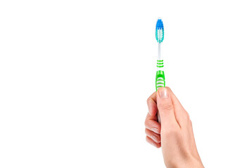 Color new toothbrush with hand isolated on a white background..