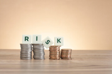 Financial Risk concept. Risk on white cubes on the stacked coins