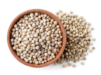 Dry white peppercorns in a plate on a white background, isolated. Top view