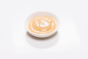 Mushroom sauce in a bowl isolated on white background.