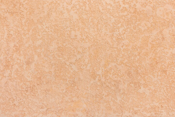 Light warm sand wall with abstract pattern and interior texture of stucco background