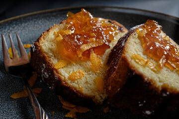 Two pieces of cake with topping of orange jam