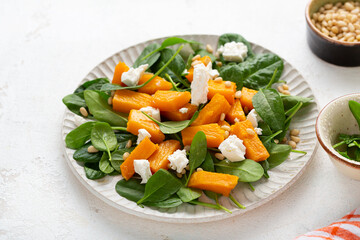 Close up of Roasted pumpkin salad with greens food