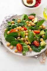 Close up of vegan slad with avocado chickpea and spinach