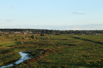 Fototapeta premium Village near field and river