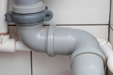 Sewer pipes in home, connection of grey polipropilen pipes for wash basin, washbowl drain
