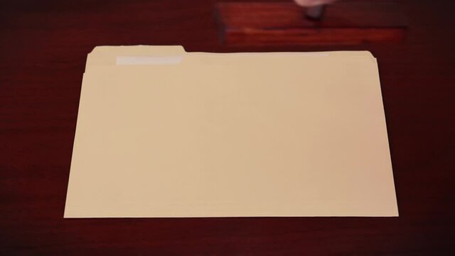 Folder being stamped "CASE CLOSED
