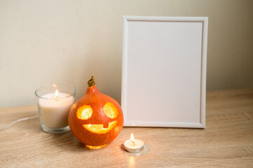 Autumn minimal composition. Thanksgiving holiday concept. Photo frame, pumpkin on white background.