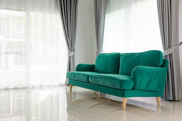 Green sofa in living room interior home background