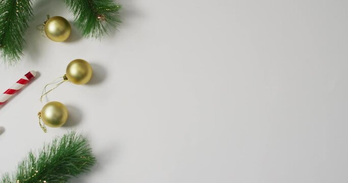 Video of christmas decorations with baubles and copy space on white background