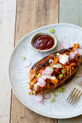 Baked sweet potato with barbeque jackfruit