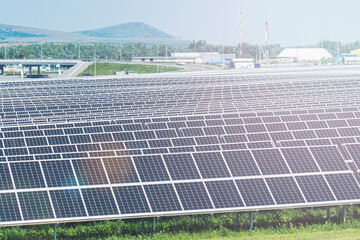 solar-powered power plant, solar module panels on the sky background. Solar energy. Environmental theme. The concept of green energy, selective focusing, glare from the sun, tinting