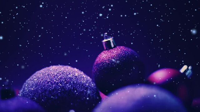Snowy Christmas holidays background, snow and purple baubles as festive winter decoration. High quality FullHD footage