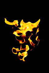 Real flames from underground gas isolated on black