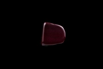 Close-up Red Jasper stone isolated on a black background.
