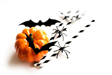 Halloween. Decorative elements for the celebration of halloween. Pumpkin, bats and spiders decor on a white background. Copy space. Selective focus. Flat layout. - 457179457