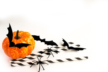 Halloween. Pumpkin, bats and spiders decor on a white background. Decorative elements for the celebration of halloween. Copy space. Selective focus. Flat layout. - 457179459