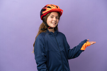 Little caucasian girl isolated on purple background extending hands to the side for inviting to come