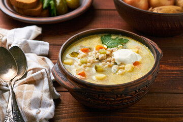 russian pickle soup with pearl barley and sour creame