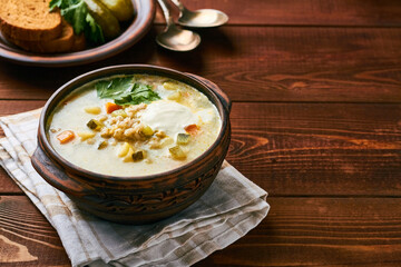 russian pickle soup with pearl barley and sour creame