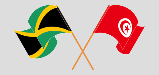 Crossed and waving flags of Jamaica and Tunisia