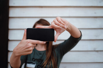 woman enjoying sea air on autumn beach before thunderstorm