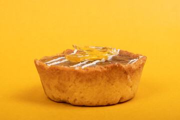 chocolate marijuana pie, CBD butter dessert medical use on yellow background close-up.