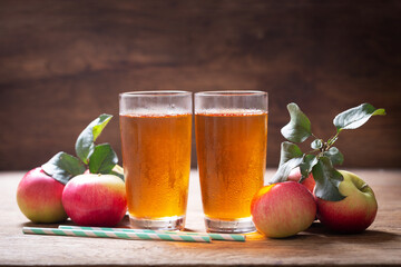 glasses of apple juice with fresh fruits