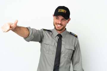 Young security Brazilian man isolated on white background giving a thumbs up gesture