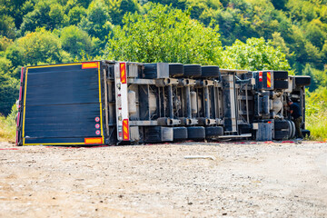 Large cargo truck turned over on road traffic accident