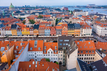Fototapeta premium Aerial view of famous Nyhavn pier with colorful buildings and boats in Copenhagen, Denmark. The most popular place in Copenhagen.
