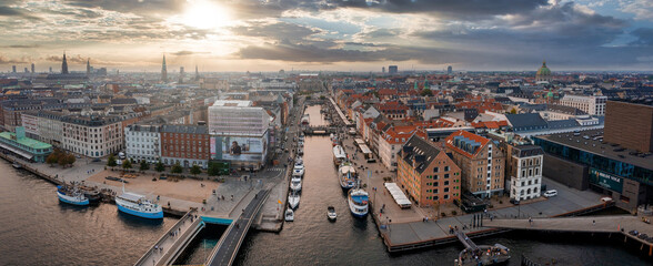 Aerial view of famous Nyhavn pier with colorful buildings and boats in Copenhagen, Denmark. The...