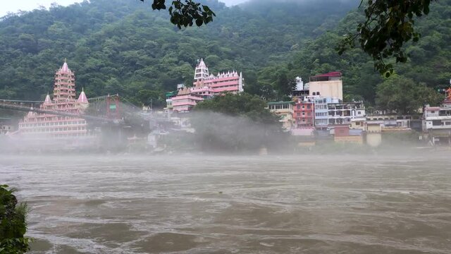 Thick fog over the surface of the Ganges River in Rishikesh, India. A trip to the Himalayas during the rainy season