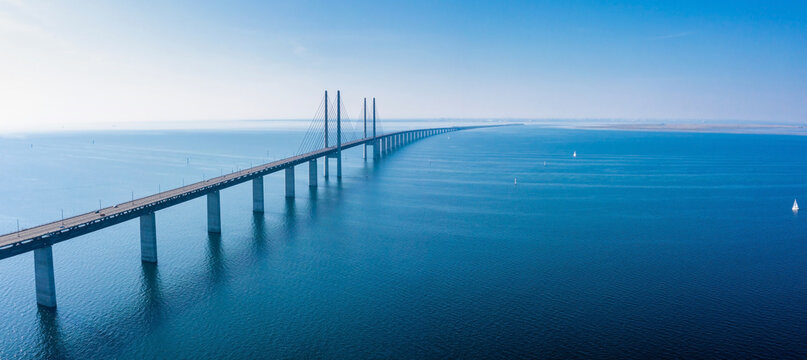 Fototapeta Panoramic aerial view of the Oresundsbron bridge between Denmark and Sweden. Oresund Bridge view at sunset.