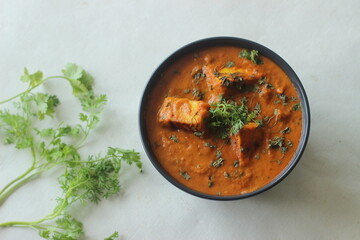 Paneer masala. A curry made with cottage cheese cubes cooked in a gravy of onions tomatoes and spices and garnished with dried fenugreek leaves - obrazy, fototapety, plakaty