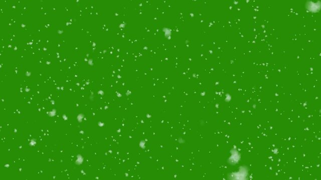 Realistic snowfall background isolated on green screen background. Seamless looped background