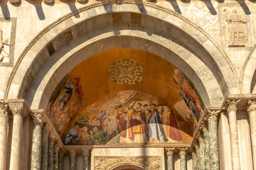 Fresco mosaic on the entrance facade of St. Mark's Basilica at St. Marks Square in Venice
