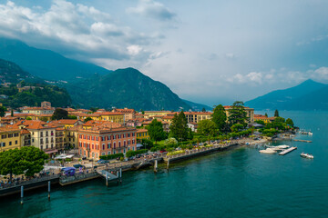 Fototapeta na wymiar Aerial view of Menaggio village on a cloudy day. Menaggio is a picturesque and traditional village, located on the western shore of Lake Como, Italy