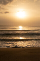 Fototapeta na wymiar sunrise on the beach sun, orange light