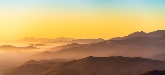 Panorama of Layers of Mountains at Sunset, Sunrise